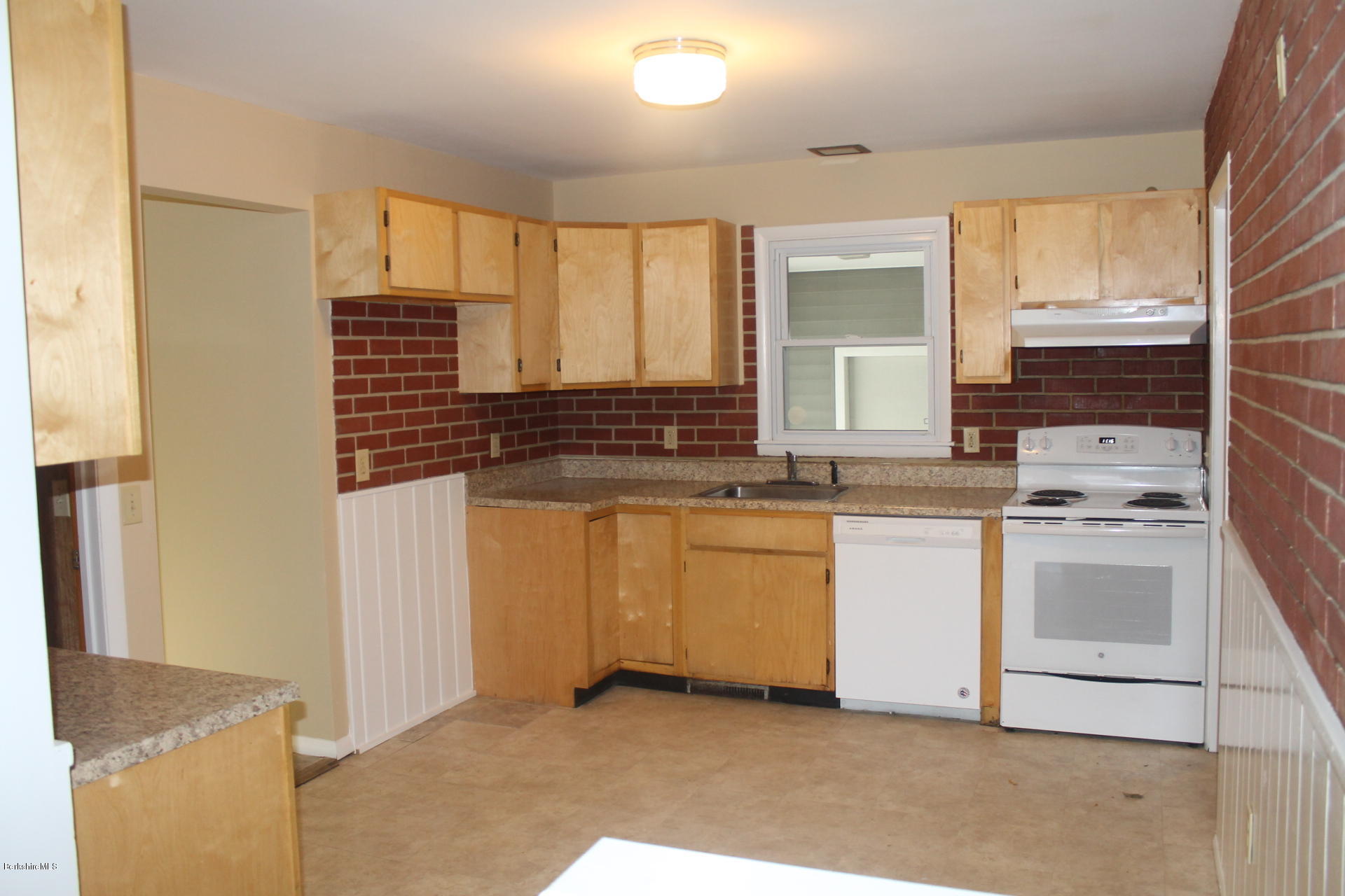986 Middle Road Clarksburg, MA 01247 - Photo 10 of 20 a kitchen with granite countertop a sink and a stove