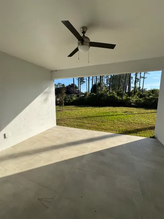 a view of an empty room and wooden floor