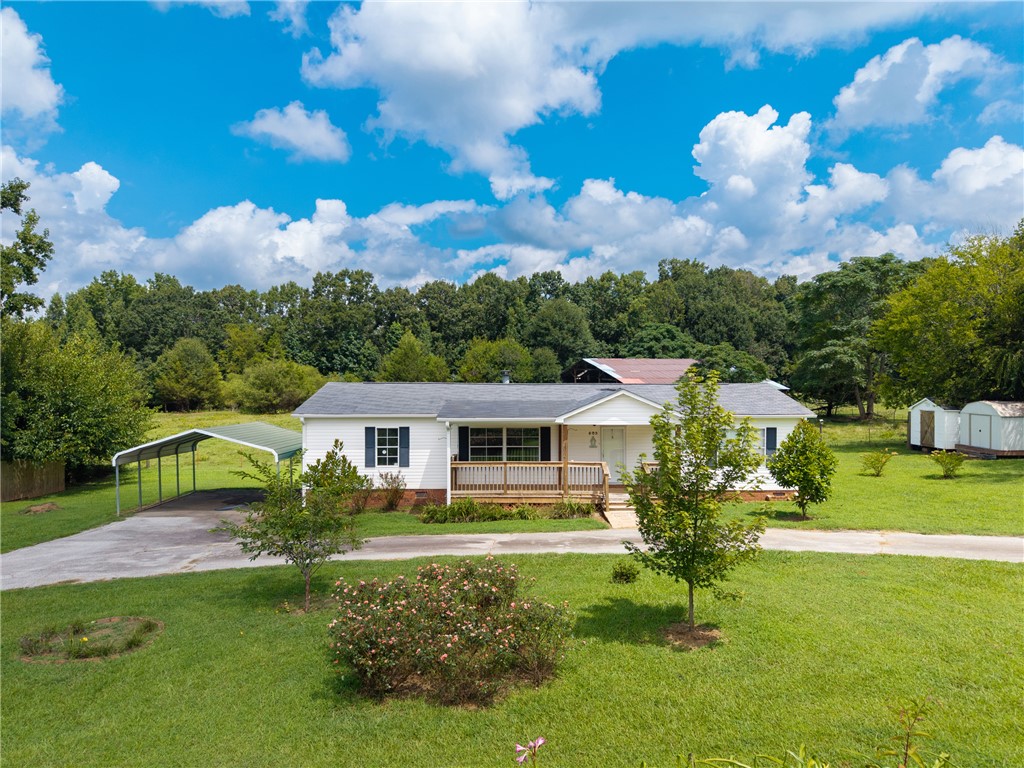 503 Mulliken Road Central, SC 29630 - Photo 25 of 50 A well-maintained ranch home sits gracefully on a lush lot, offering a welcoming front porch and ample outdoor space.