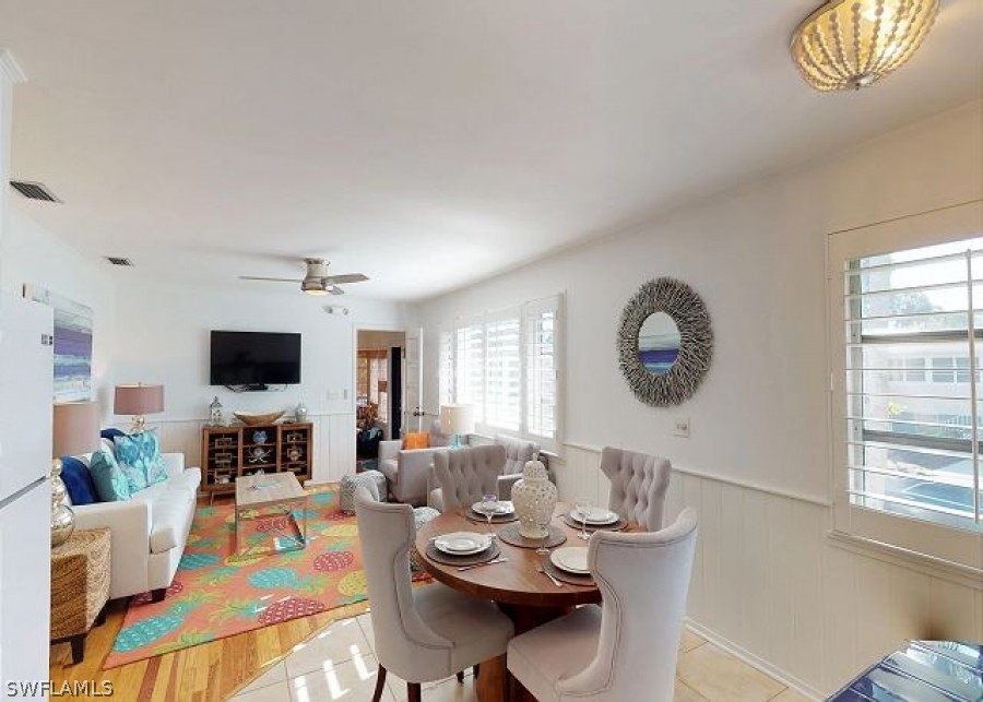 151 Mandalay Road Fort Myers Beach, FL 33931 - Photo 11 of 32 a living room with furniture kitchen view and a window