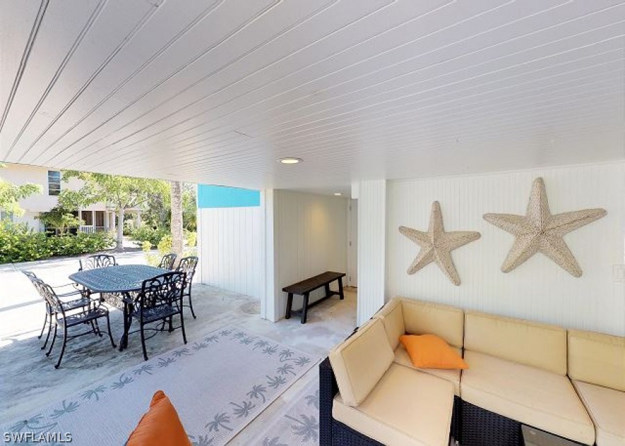151 Mandalay Road Fort Myers Beach, FL 33931 - Photo 24 of 32 a view of a dining room with furniture window and outside view