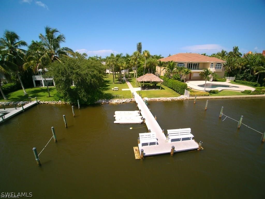 151 Mandalay Road Fort Myers Beach, FL 33931 - Photo 29 of 32 a view of swimming pool with outdoor seating and lake view