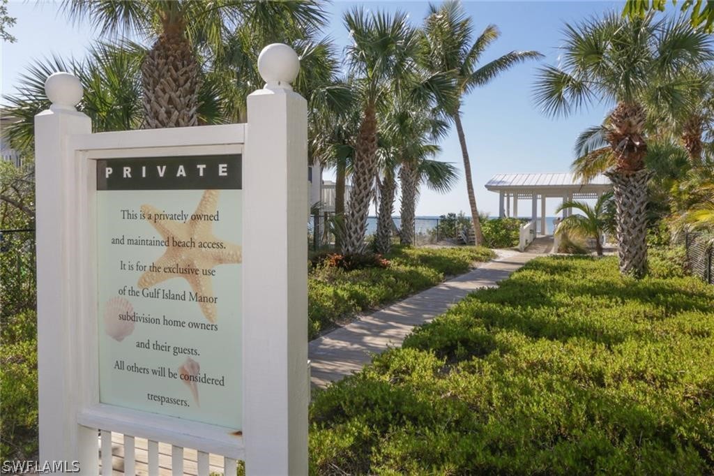 151 Mandalay Road Fort Myers Beach, FL 33931 - Photo 32 of 32 a sign that is on the side of a road