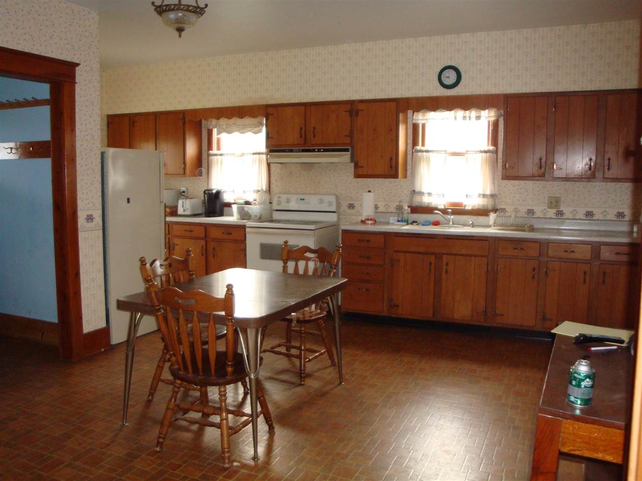 8701 Squaw Prairie Road Garden Prairie, IL 61038 - Photo 5 of 28 a kitchen with kitchen island granite countertop wooden floors cabinets a dining table and chairs