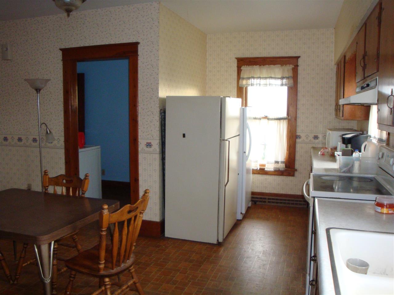 8701 Squaw Prairie Road Garden Prairie, IL 61038 - Photo 6 of 28 a view of a kitchen area with furniture and wooden floor