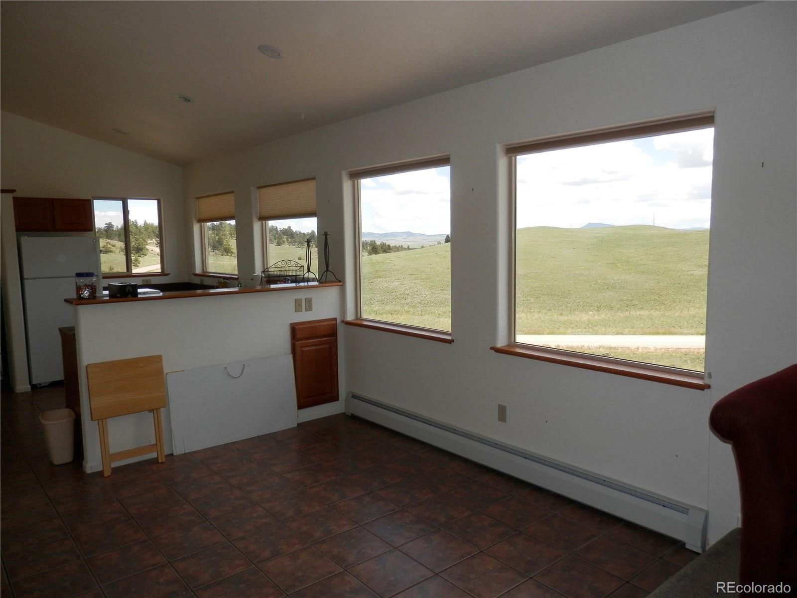 4469 Ranch Road Hartsel, CO 80449 - Photo 13 of 40 a kitchen with a window a sink and a counter top space