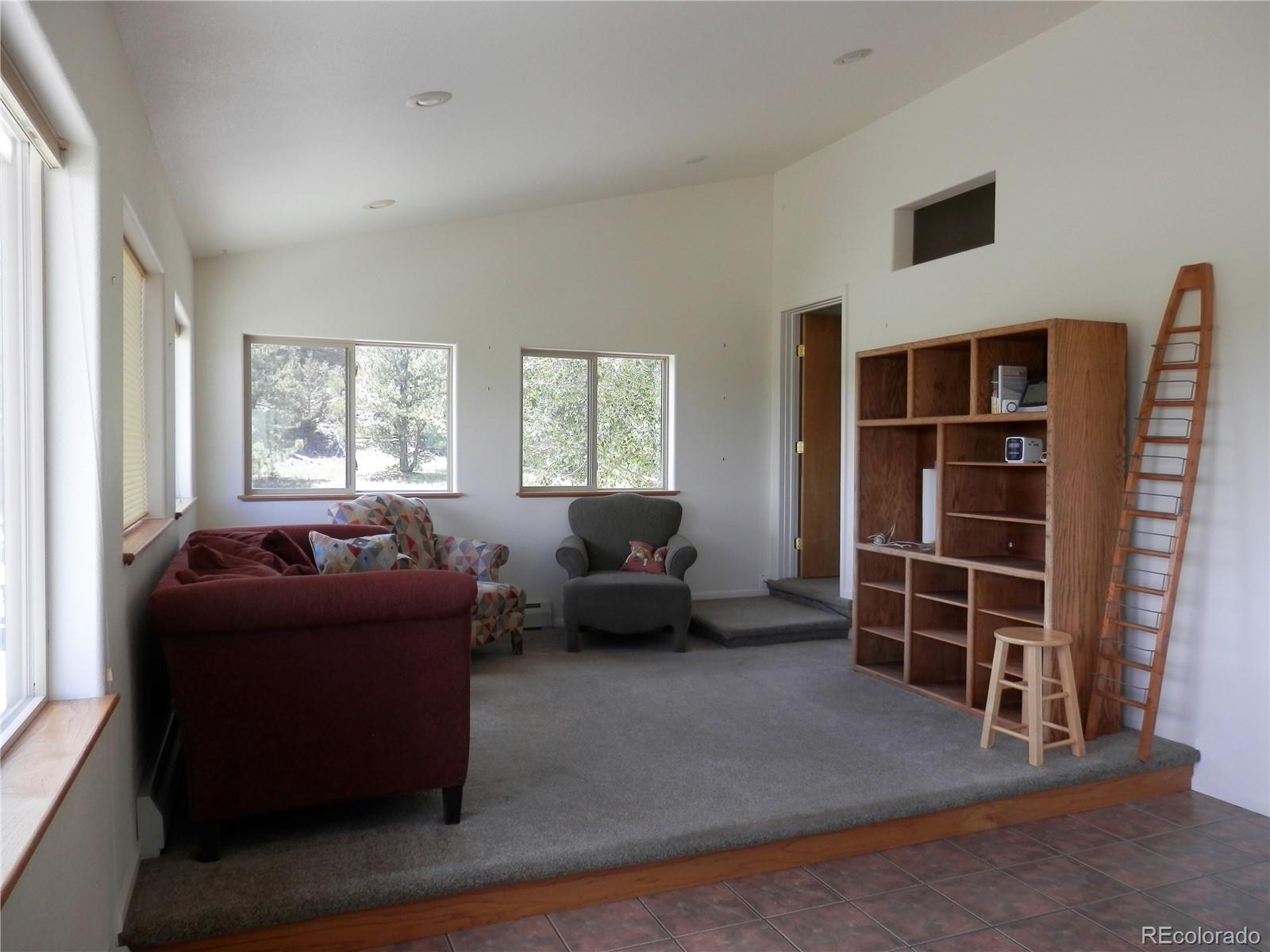 4469 Ranch Road Hartsel, CO 80449 - Photo 14 of 40 a living room with furniture and a window