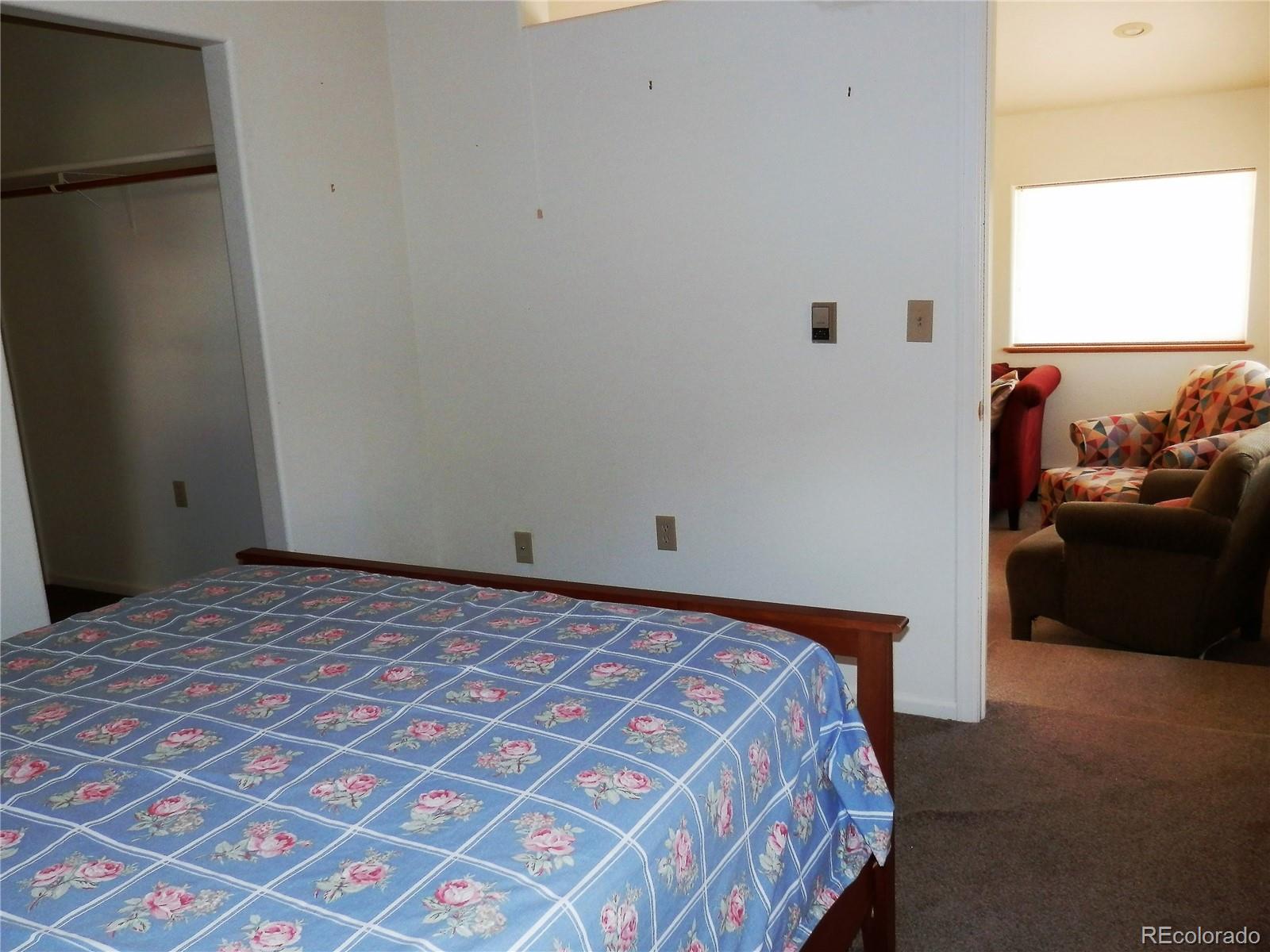 4469 Ranch Road Hartsel, CO 80449 - Photo 20 of 40 a bedroom with a bed and a couch