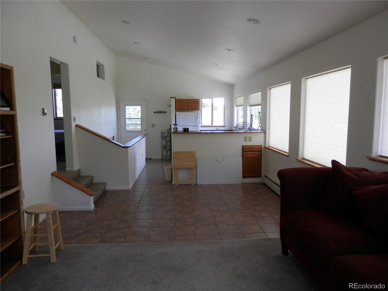 4469 Ranch Road Hartsel, CO 80449 - Photo 21 of 40 a living room with furniture and a wooden floor