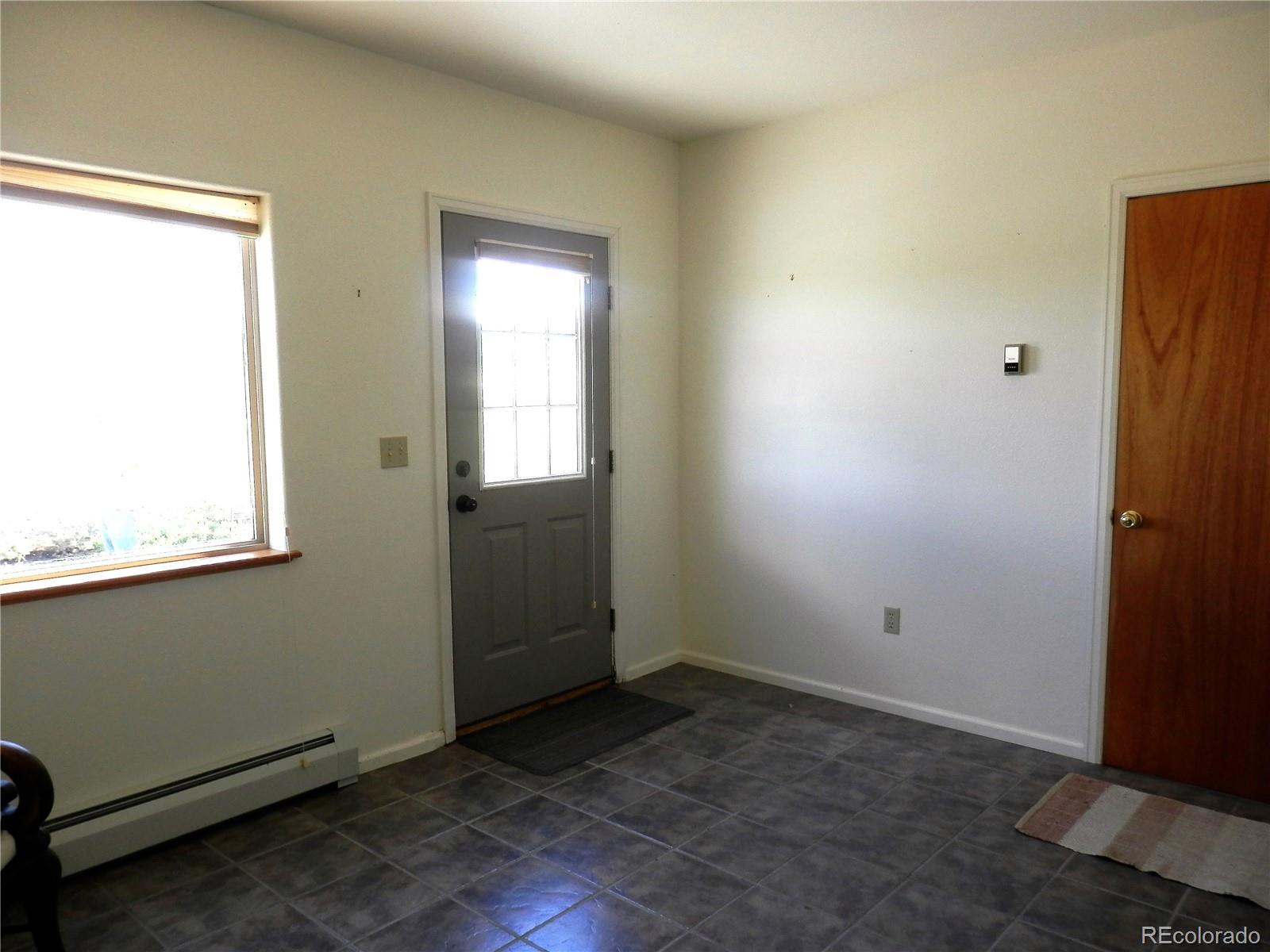 4469 Ranch Road Hartsel, CO 80449 - Photo 23 of 40 an empty room with windows