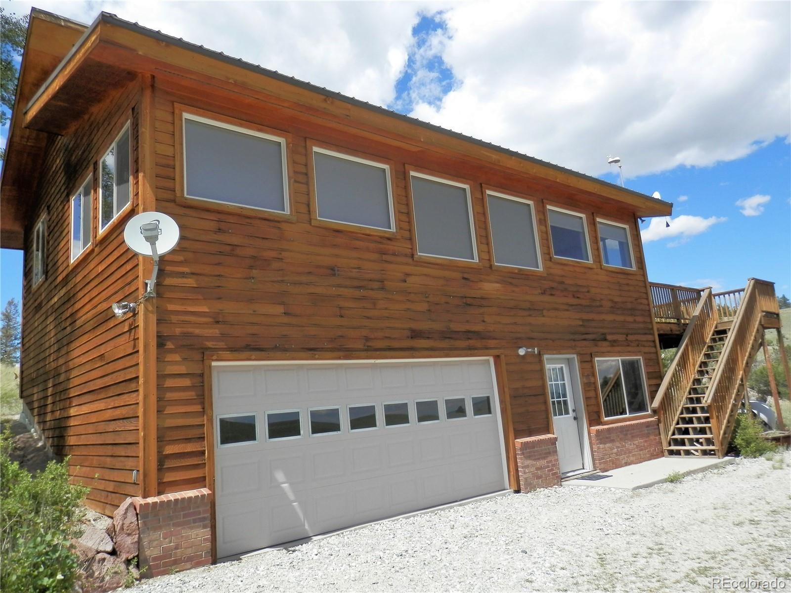 4469 Ranch Road Hartsel, CO 80449 - Photo 32 of 40 a front view of a house with many windows