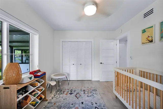 a bedroom with furniture and a window