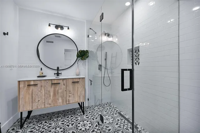 a bathroom with a sink a vanity and a mirror