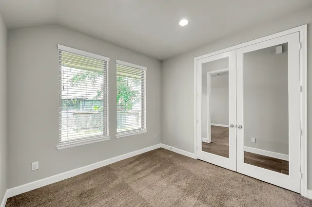 an empty room with windows