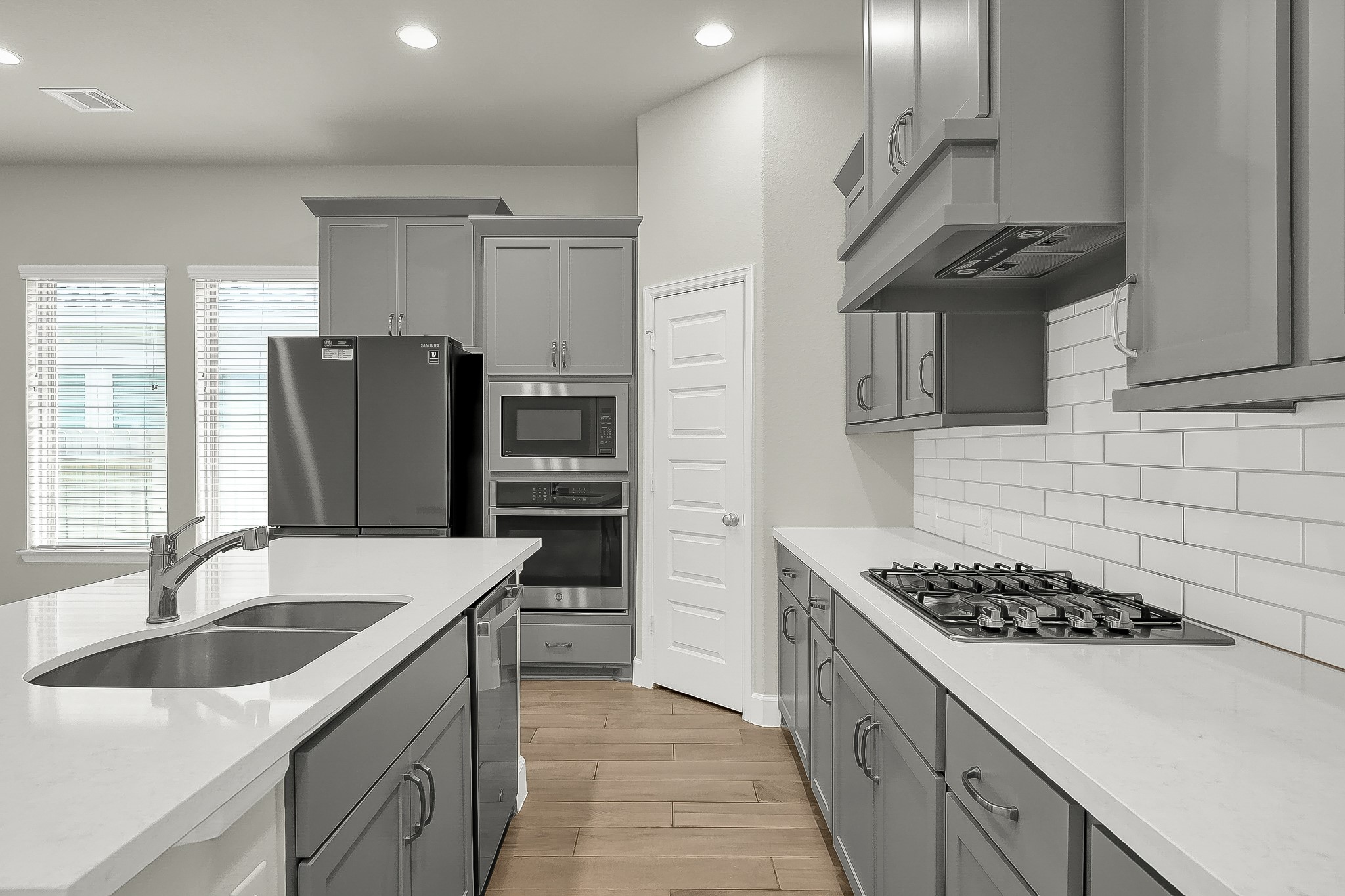 328 Rise Lane Montgomery, TX 77316 - Photo 15 of 49 a kitchen with stainless steel appliances granite countertop a sink stove and refrigerator
