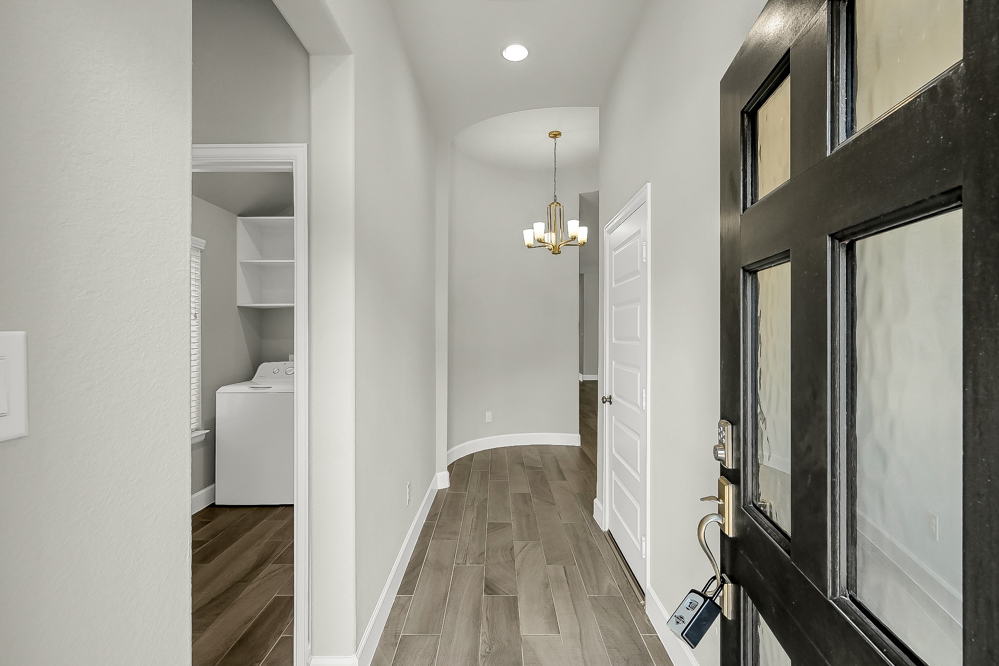 328 Rise Lane Montgomery, TX 77316 - Photo 2 of 49 a view of a hallway with wooden floor and staircase