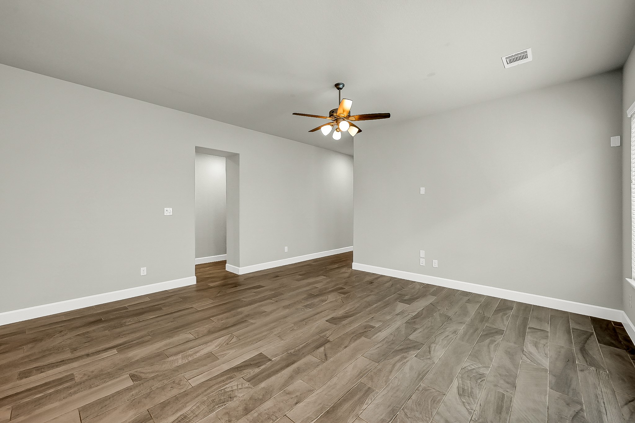 328 Rise Lane Montgomery, TX 77316 - Photo 21 of 49 a view of an empty room with wooden floor