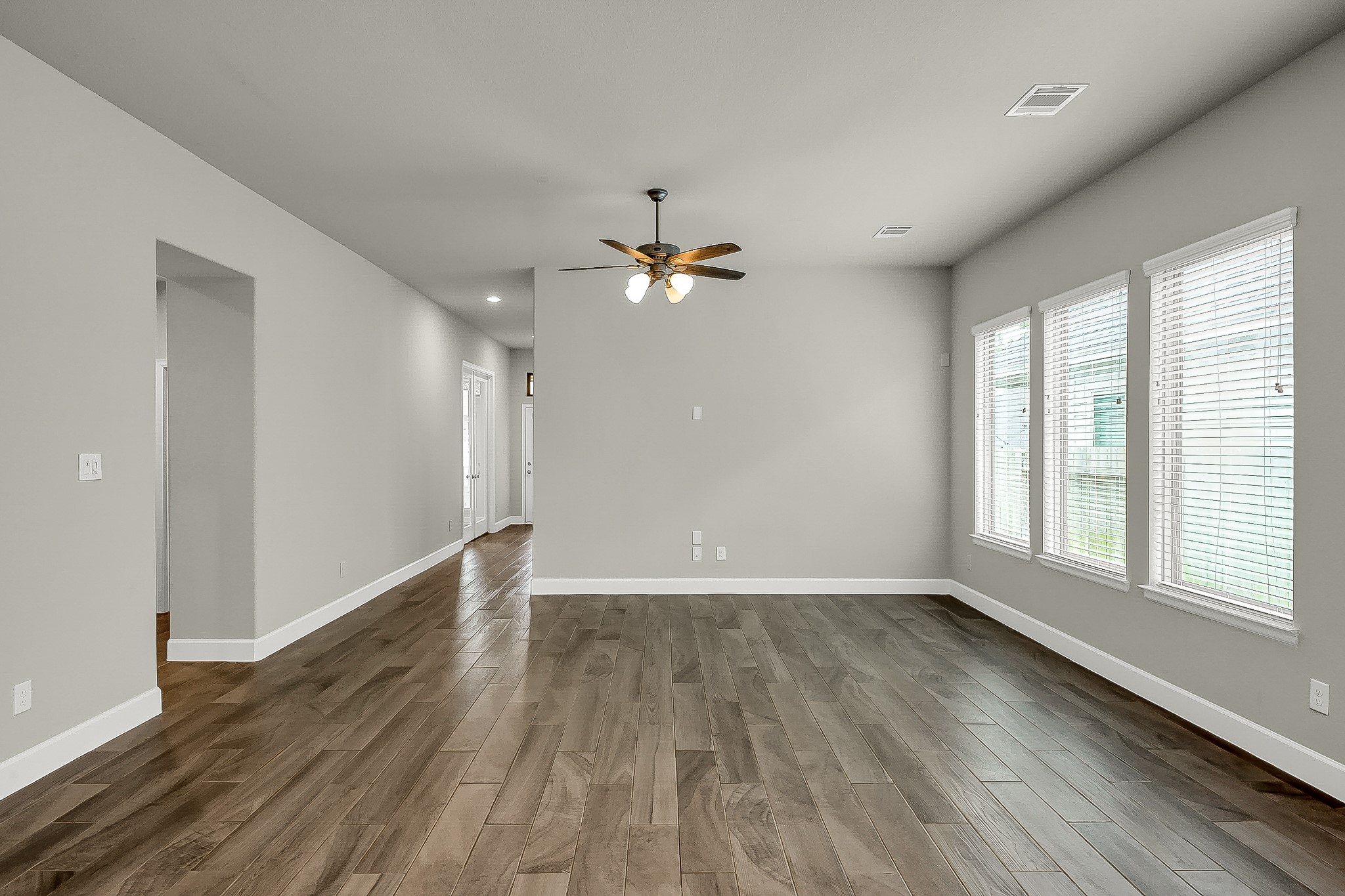 328 Rise Lane Montgomery, TX 77316 - Photo 22 of 49 wooden floor in an empty room with a window