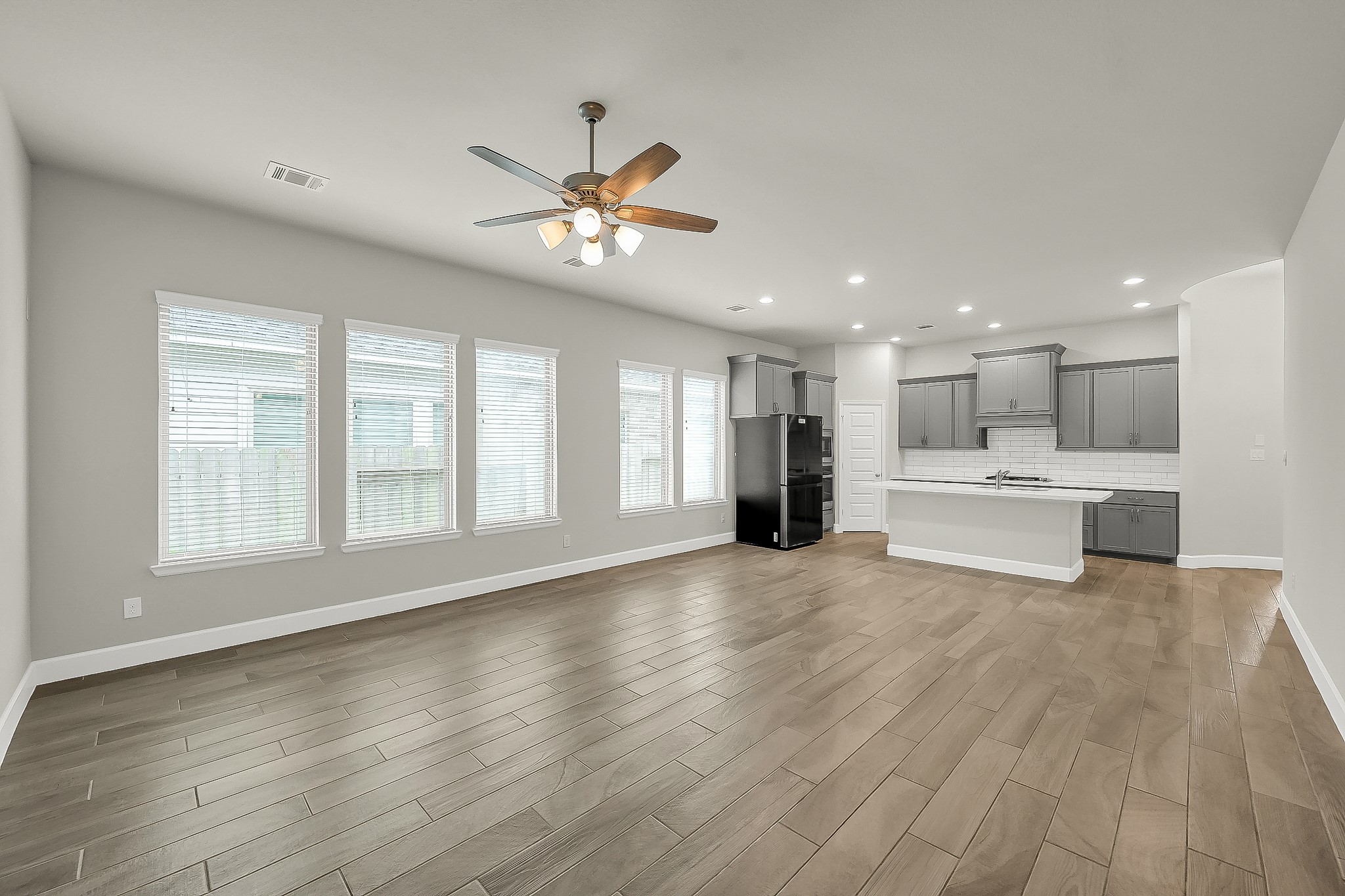 328 Rise Lane Montgomery, TX 77316 - Photo 24 of 49 a view of an empty room with a kitchen and a window