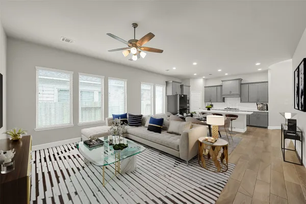 a living room with furniture and a large window