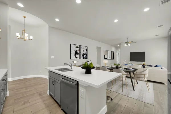 a view of a dining room with furniture and a flat screen tv