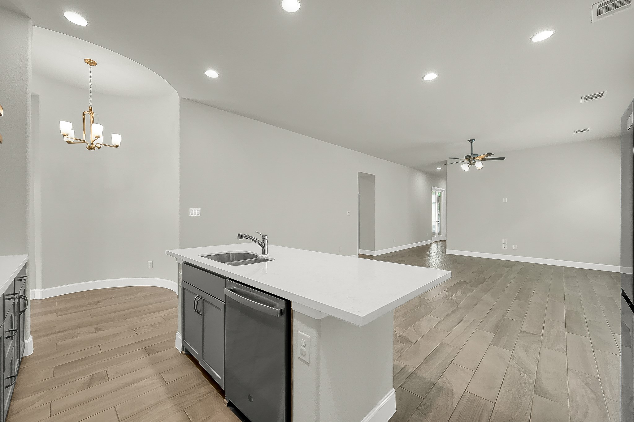 328 Rise Lane Montgomery, TX 77316 - Photo 8 of 49 a kitchen with a sink and a stove top oven