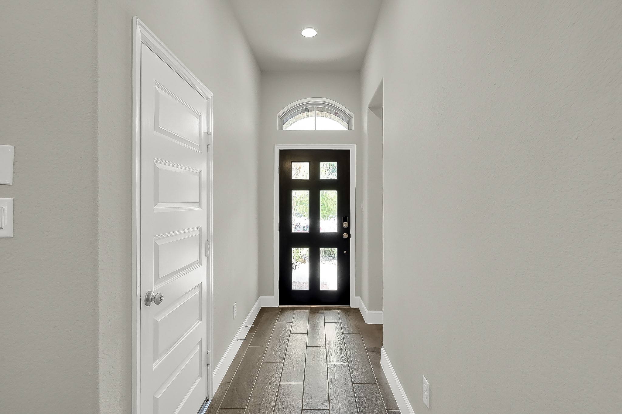 328 Rise Lane Montgomery, TX 77316 - Photo 10 of 49 a view of a hallway view with wooden floor and a window