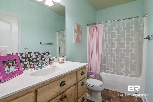 11099 Niblick Loop Fairhope, AL 36532 - Photo 29 of 33 Bath for Bedroom 3 & 4; hallway has pocket door to close off from Kitchen area