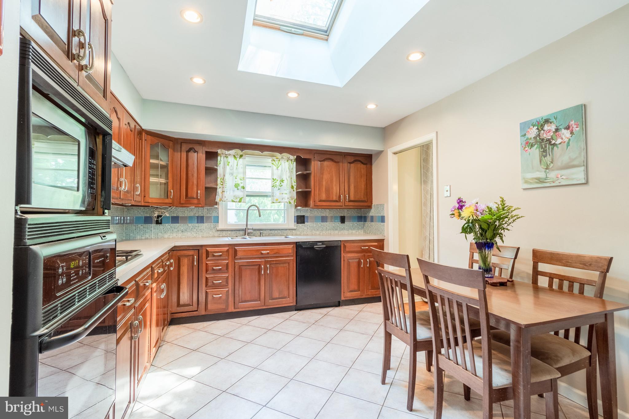 Large updated eat-in kitchen with skylight
