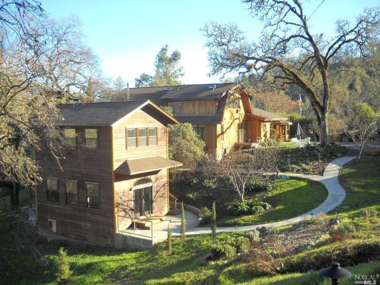 831 Riverside Drive Ukiah, CA 95482 - Photo 1 of 1 a front view of a house with garden