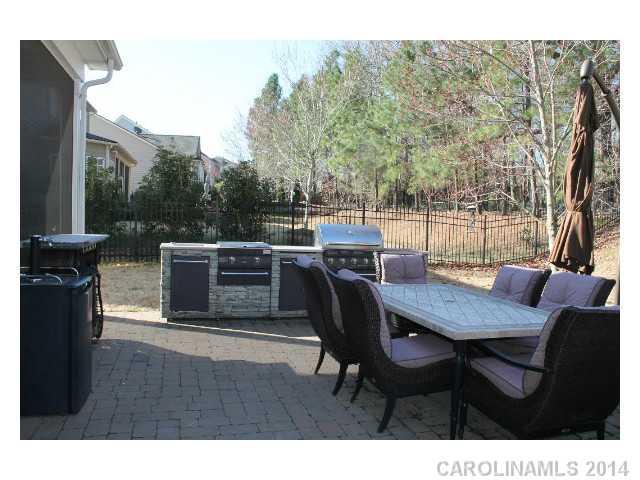 573 Quicksilver Trail Fort Mill, SC 29708 - Photo 14 of 16 a view of a dinning table and chairs in the patio