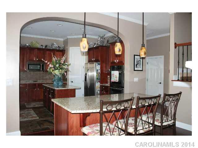 573 Quicksilver Trail Fort Mill, SC 29708 - Photo 6 of 16 a view of a dining room with furniture