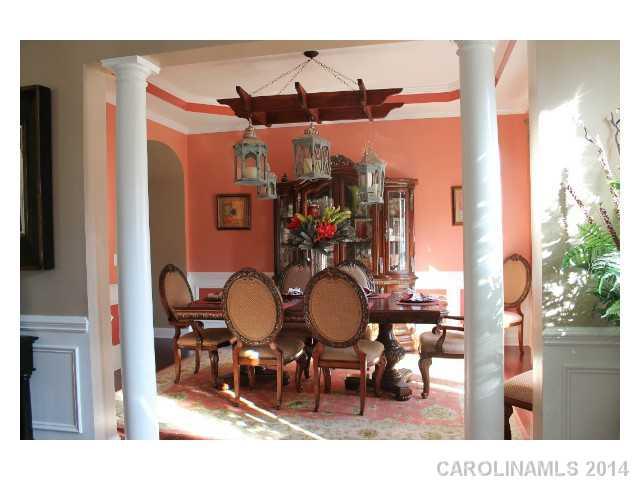 573 Quicksilver Trail Fort Mill, SC 29708 - Photo 8 of 16 a view of a dining room with furniture and chandelier