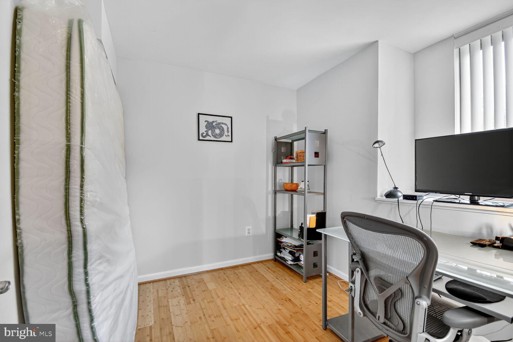 1001 North Vermont Street, Unit 102 Arlington, VA 22201 - Photo 14 of 27 a view of a livingroom with furniture and a flat screen tv