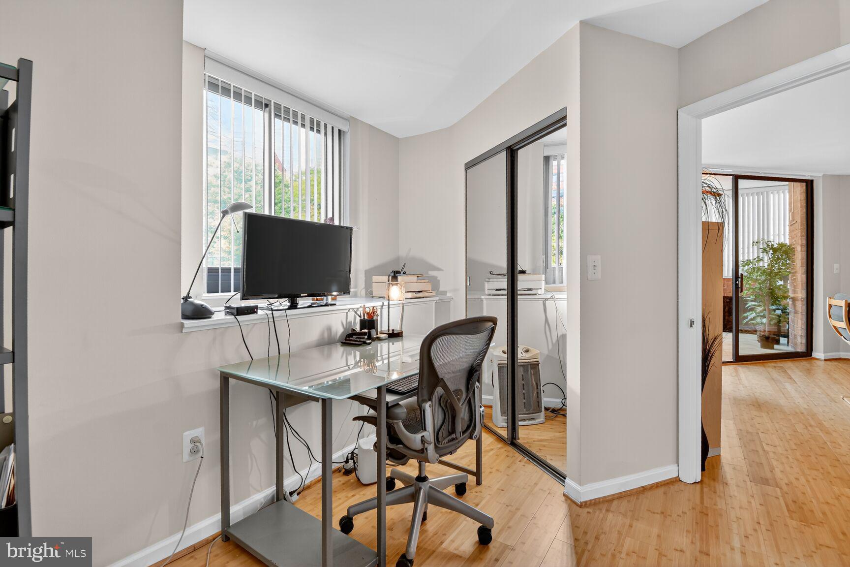 1001 North Vermont Street, Unit 102 Arlington, VA 22201 - Photo 15 of 27 a view of a workspace with furniture and a window