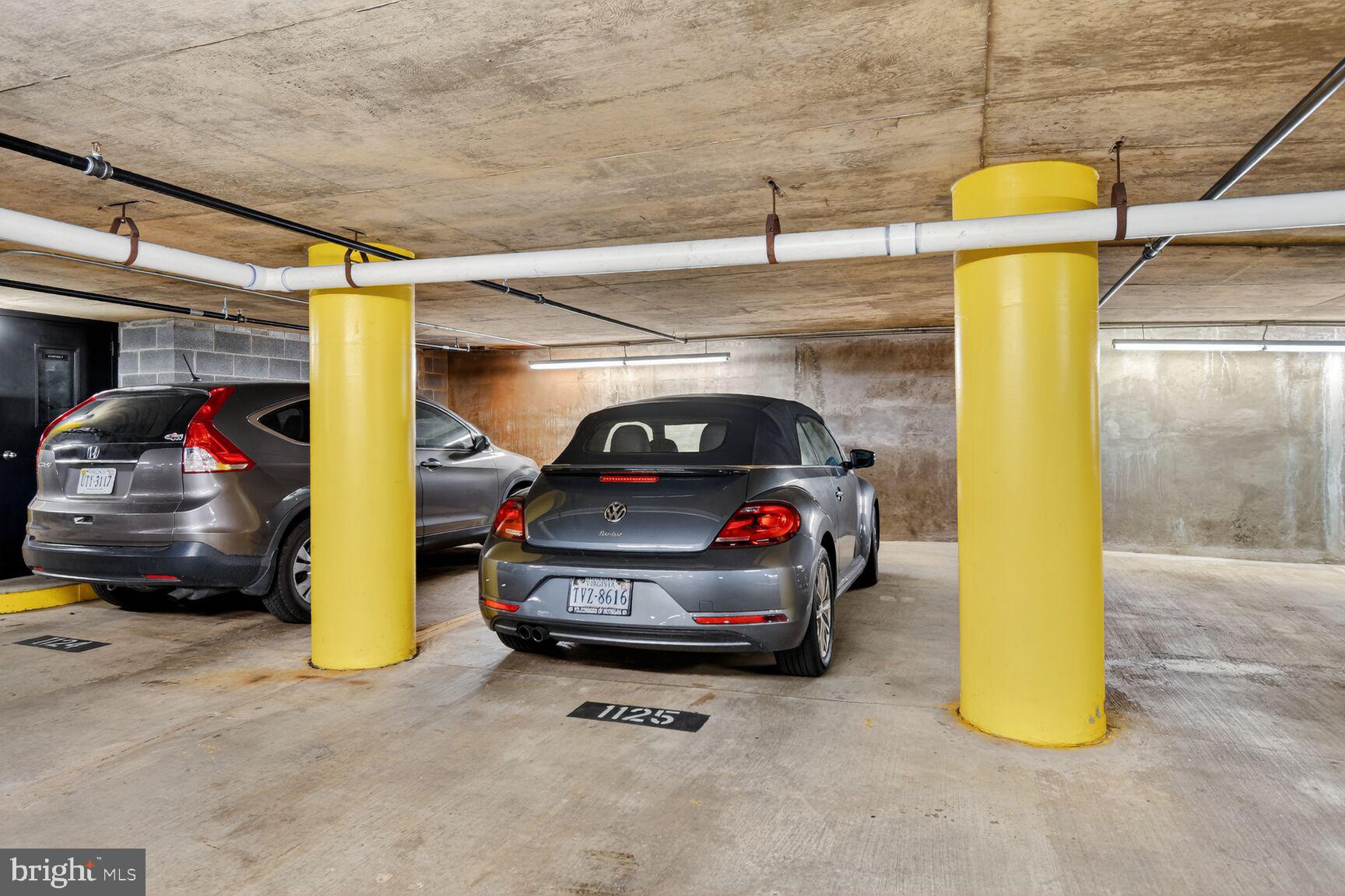 1001 North Vermont Street, Unit 102 Arlington, VA 22201 - Photo 16 of 27 a view of parking garage with a couch and a potted plant