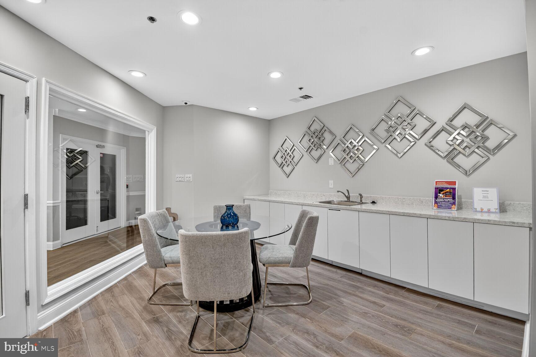 1001 North Vermont Street, Unit 102 Arlington, VA 22201 - Photo 21 of 27 a dining room with furniture and window
