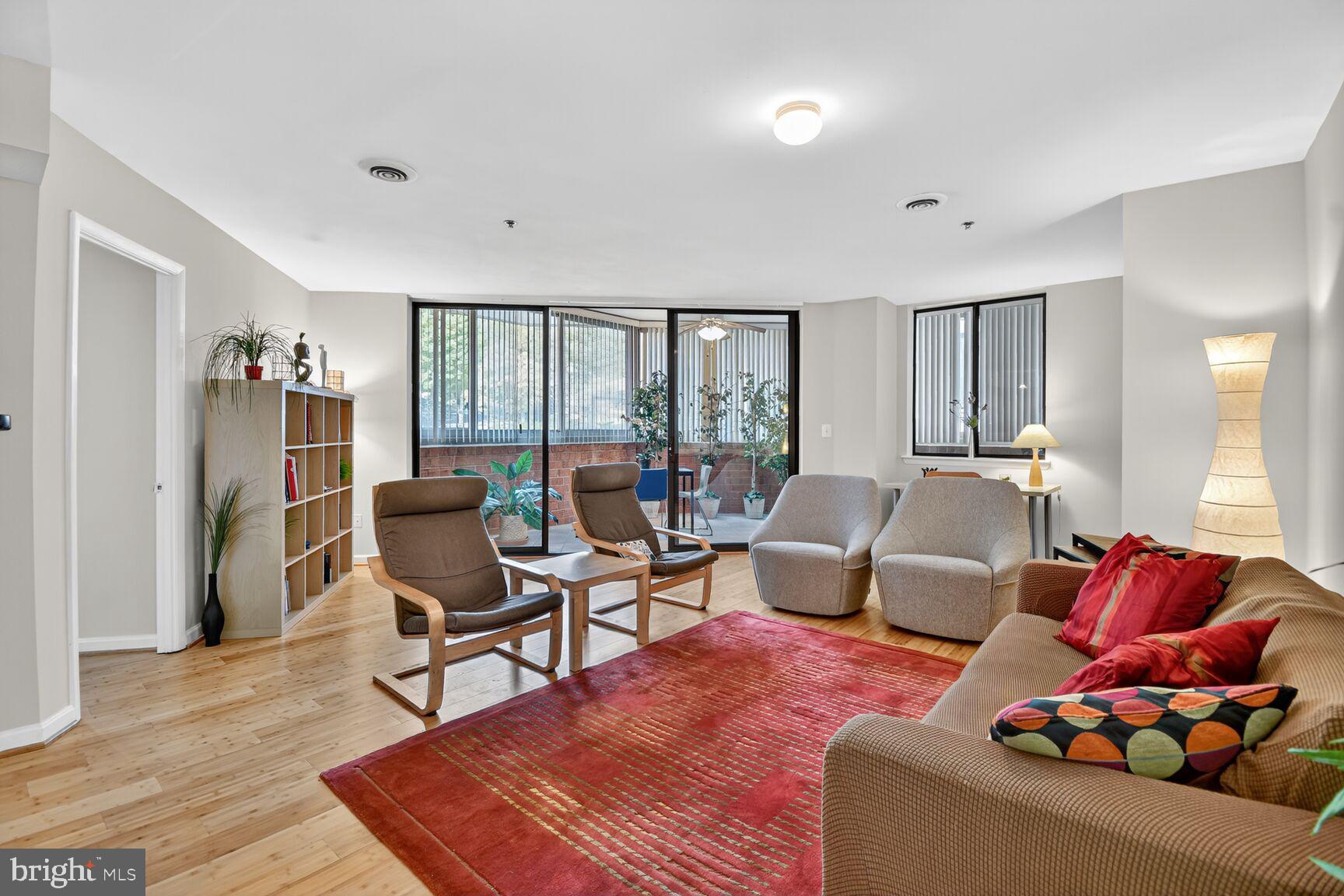 1001 North Vermont Street, Unit 102 Arlington, VA 22201 - Photo 3 of 27 a living room with furniture and a window