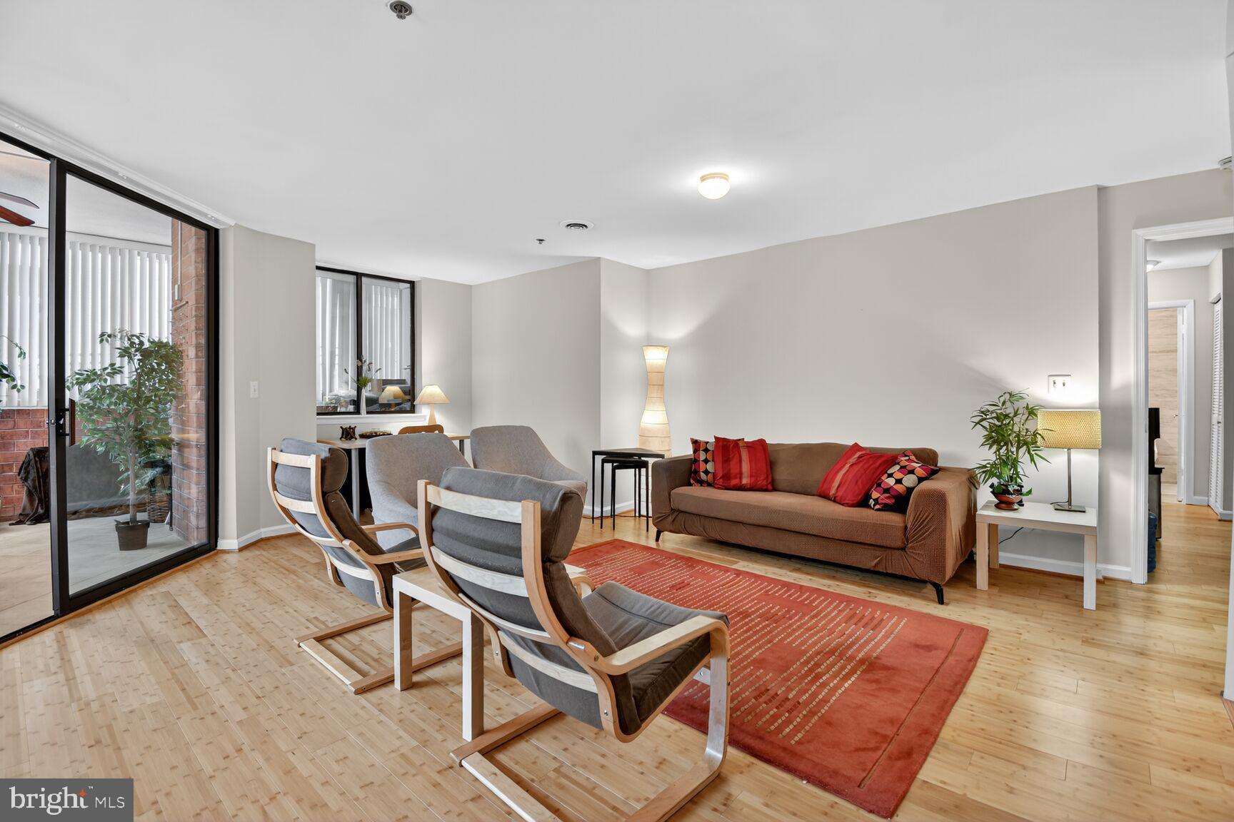 1001 North Vermont Street, Unit 102 Arlington, VA 22201 - Photo 4 of 27 a living room with furniture and wooden floor