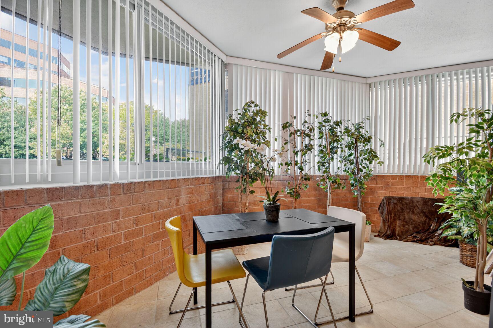 1001 North Vermont Street, Unit 102 Arlington, VA 22201 - Photo 8 of 27 a dining room with furniture and potted plants