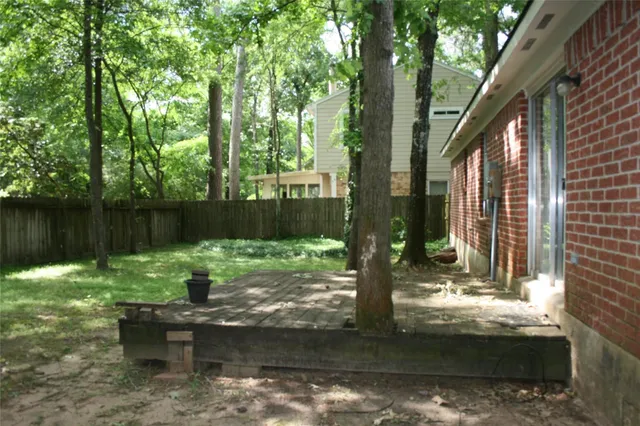 a backyard of a house with lots of green space