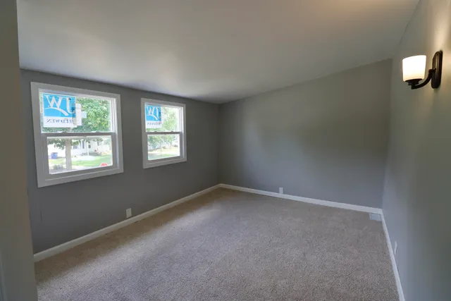 an empty room with windows