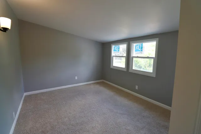 an empty room with windows