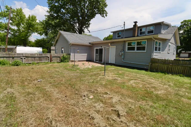 a house view with a backyard space