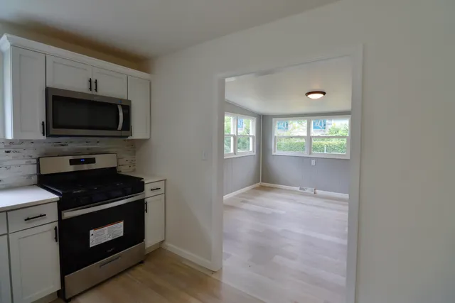 a kitchen with a stove and a microwave