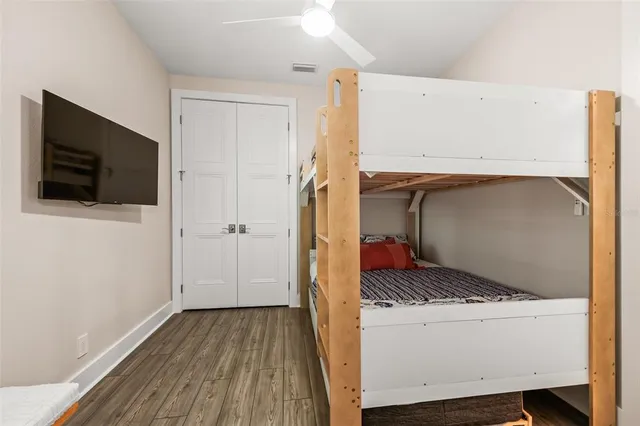 a bath tub sitting next to a white sink and a shower