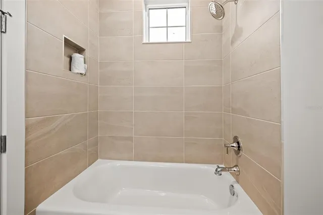 a bathroom with a double vanity sink toilet and mirror