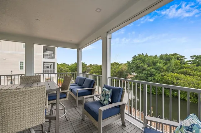 a view of a patio with a dining table and chairs