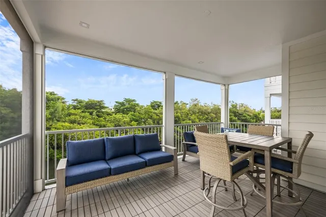 a view of a patio with a table chairs and backyard