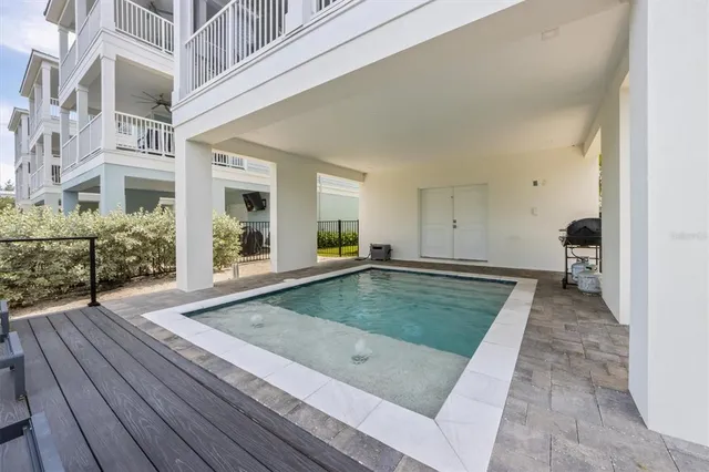 a view of a chairs and table on the wooden floor